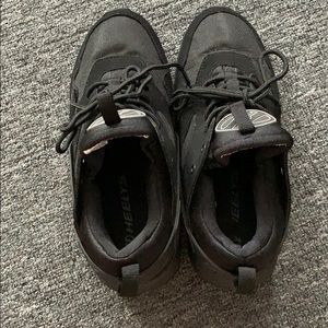 Black Heelys! New & never worn.
